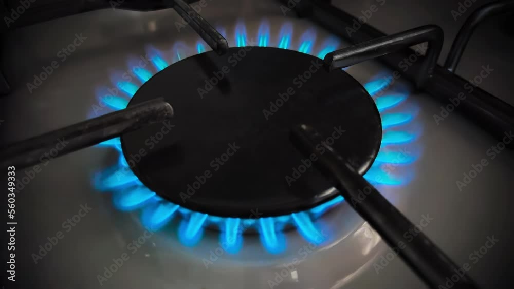 Close-up footage of fire burner on gas kitchen stove