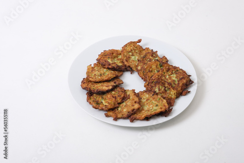 Traditional Turkish Zuccini Mucver. Mucver is a Turkish fritter or pancake, made from grated zucchini isolated on white background