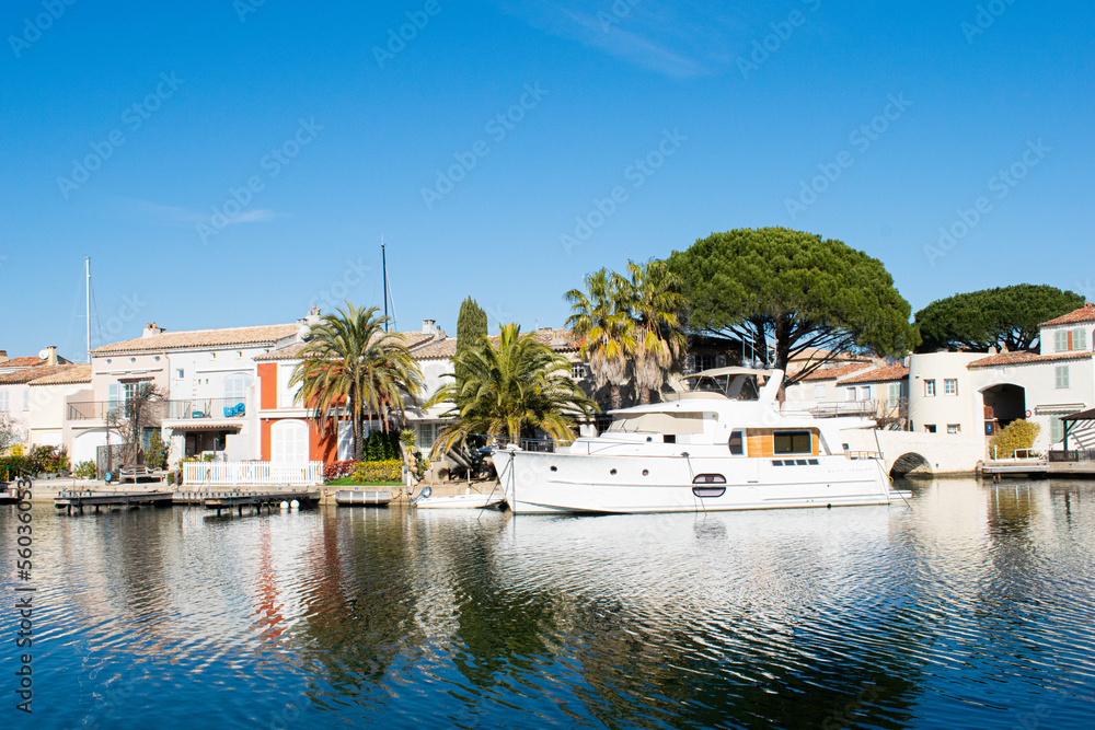 Port grimaud hotels boats and river with palm tree