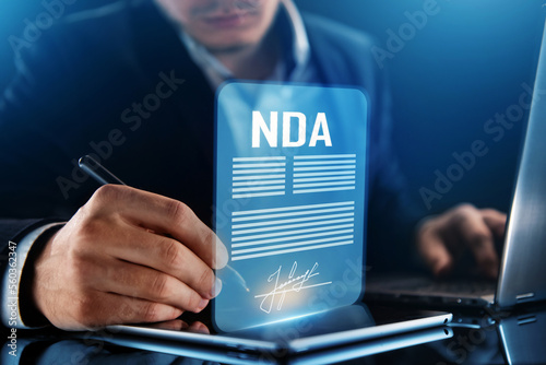 Obraz na plátně Non disclosure agreement concept. Businessman signs NDA document