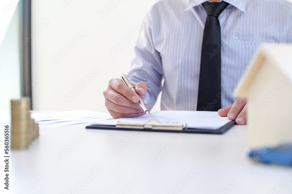 Business people signing contract making a deal with real estate agent Concept for consultant and home insurance concept.
