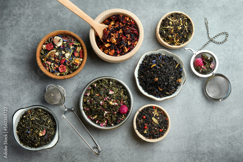 Many different herbal teas on grey table  flat lay