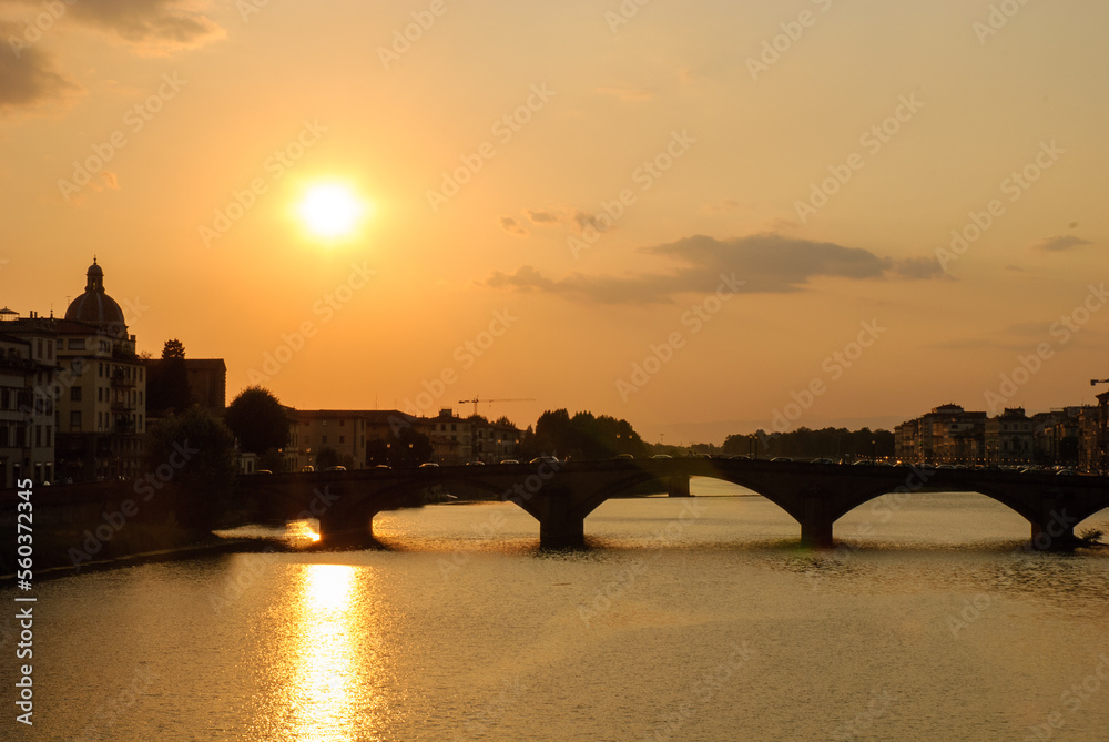 Sunset on river Arno and ponte Santa Trinita