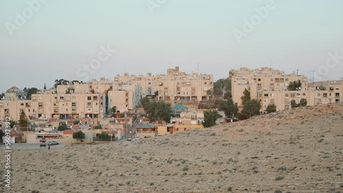 Wide shot of typical affordable living buildings and neighborhoods in Israel. Desert town with small buildings and houses with water tanks on rooftops. Small village of Mitzpe Ramon, Israel photo