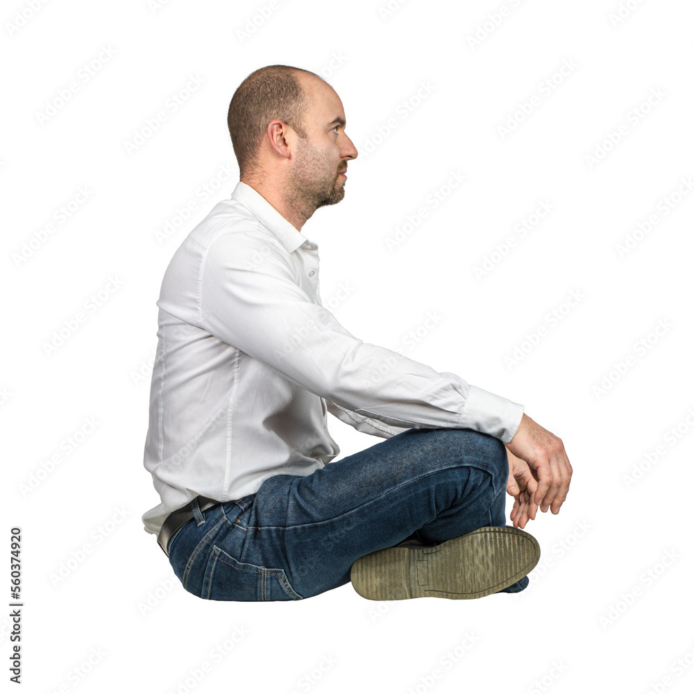 businessman sitting cross-legged, side view. businessman sitting cross-legged, side view.