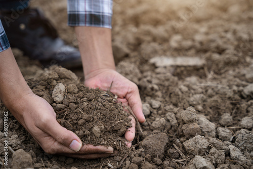 Soil in the hands of farmers. Concept of agriculture.