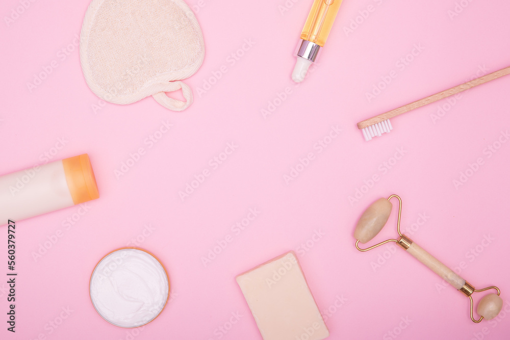 Frame from cosmetic products and hygiene items on a pink background. Beauty background. The concept of face and body care. copy space, flat lay. Frame from cosmetic products and hygiene items on a pink background. Beauty background. The concept of face and body care. copy space, flat lay.