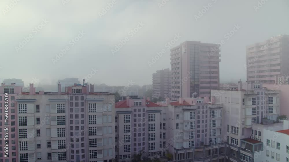 Panning the city in the morning with heavy fog. Lisbon in the morning in foggy weather. European city in the early morning Panning the city in the morning with heavy fog. Lisbon in the morning in foggy weather. European city in the early morning
