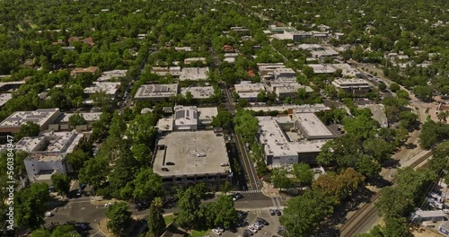 Davis California Aerial v3 birds eye view drone flyover urban town center next to uc davis campus with agricultural farmland in the background in summer - Shot with Mavic 3 Cine - June 2022