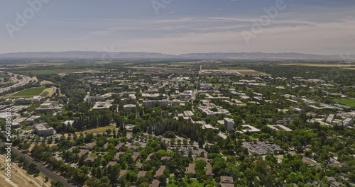 Davis California Aerial v2 reverse flyover uc davis university campus area capturing the above view of the whole college town environment at daytime in summer - Shot with Mavic 3 Cine - June 2022