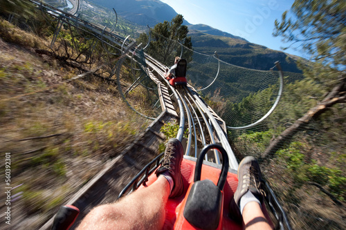 Two men ride the Alpine Coaster above Glenwood Springs at Glenwood Caverns Adventure Park, CO. photo