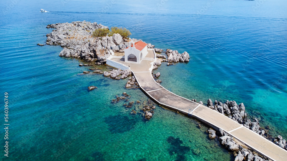 Authentic traditional Greek islands- unspoiled Chios, little church in the sea over the rocks Agios Isidoros. Eastern Aegean islands - obrazy, fototapety, plakaty 