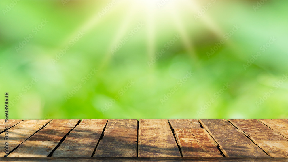 Wooden table top with natural green blurred background or various leaves, fresh bright sunlight, product empty concept. Wooden table top with natural green blurred background or various leaves, fresh bright sunlight, product empty concept.