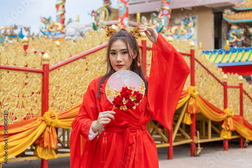 Asian girl wearing Chinese costumes decoration for Chinese new year festival celebrate culture of china © Sathit Trakunpunlert