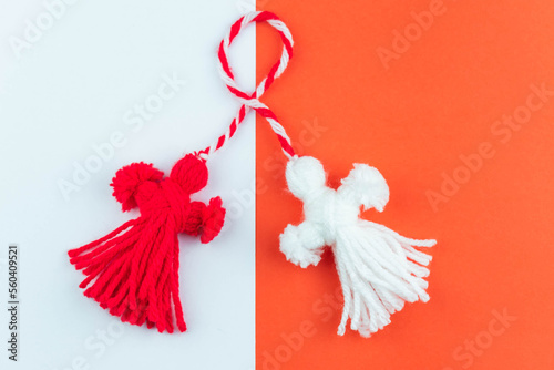 Traditional Martisor - symbol of holiday 1 March, Martenitsa, Baba Marta, beginning of spring and seasons changing in Romania, Bulgaria, Moldova. Greeting and post card for holidays. photo