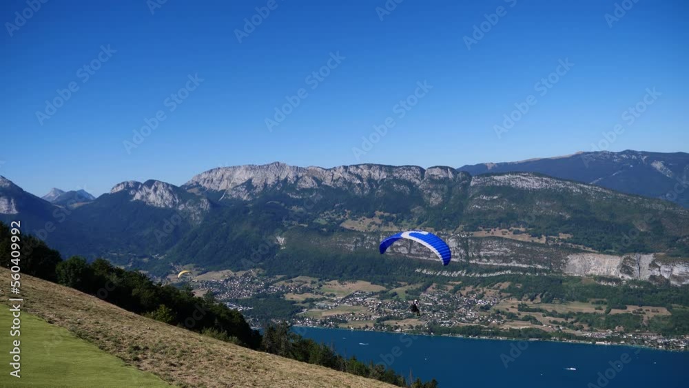 Paragliders with parapente jumping of Col de Forclaz near Annecy Paragliders with parapente jumping of Col de Forclaz near Annecy