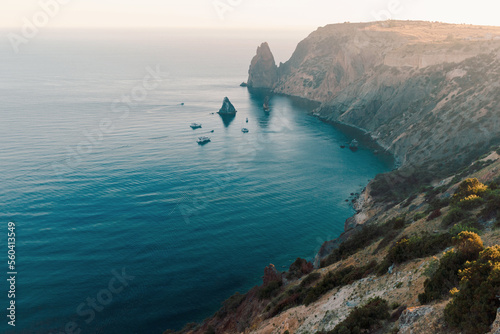 Beautiful view of mediterranean sea lagoon with blue water and cmountains in sunset soft light. Travel destination and nature tourism. Fiolent, Sevastopol, Crimea photo