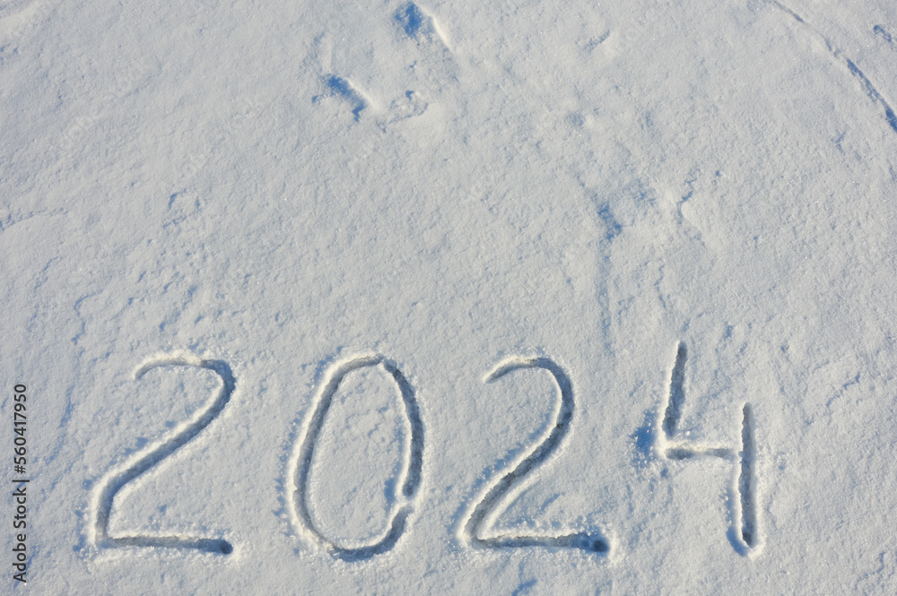 new year 2024. figures in the snow. background for winter holidays. new year 2024. figures in the snow. background for winter holidays.
