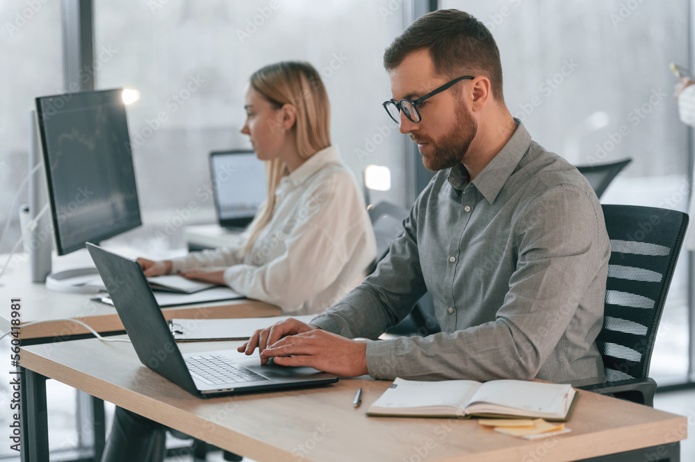 Conception of business. Successful team are working together in the office Conception of business. Successful team are working together in the office
