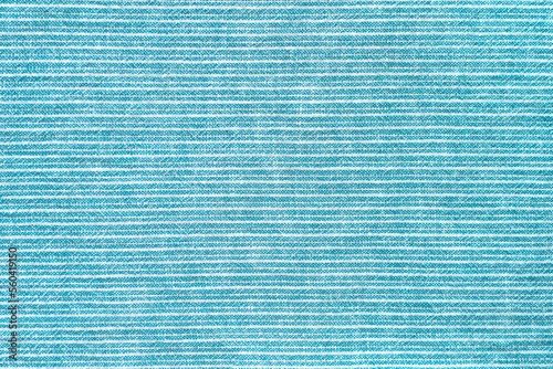 Natural linen texture as background. Cotton fabric with turquoise and white line striped pattern, texture close up, top vies, flat lay. Backdrop wallpaper. Matereal for clothes, curtain and upholstery