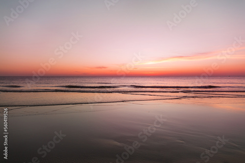 Calm sea with sunset sky with cloud.