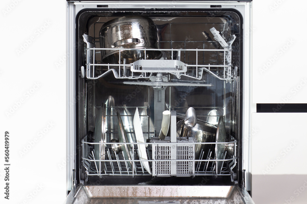 Opened dishwasher with clean dishes.
