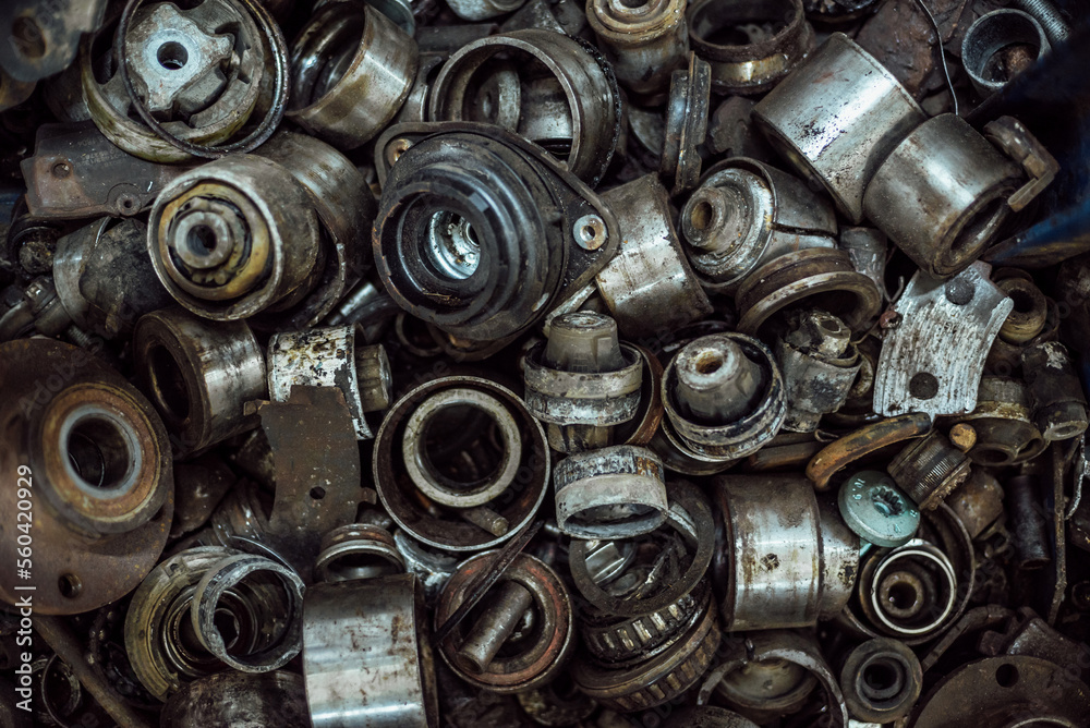 a large number of old rusty and oil-stained car parts a large number of old rusty and oil-stained car parts