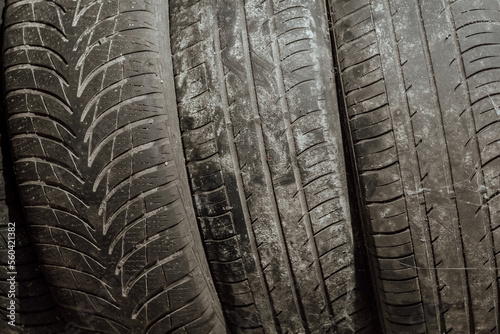 old and dirty car tires in the sand