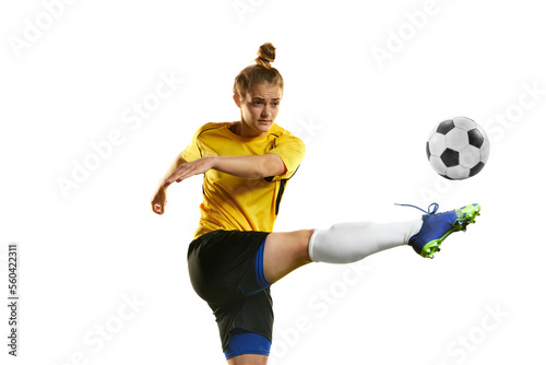 Hitting ball with leg. Young professional female football player in motion, training, playing football, soccer isolated over white background
