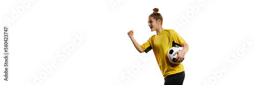Young professional female football, soccer player in motion, training, playing isolated over white background. Winning emotions. Banner, flyer