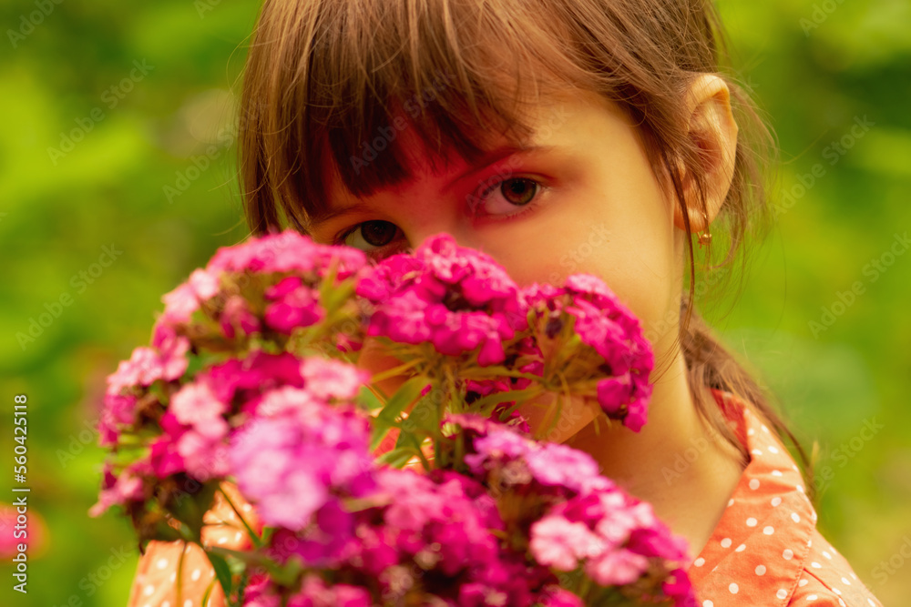 Beautiful charming cheerful young girl with colorful wildflowers. Beautiful charming cheerful young girl with colorful wildflowers.