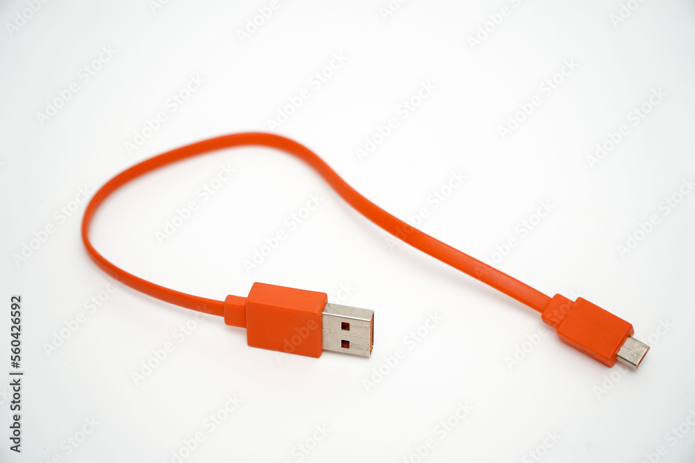 USB charging cable for smartphone orange on white background
USB charging cable for smartphone orange on white background