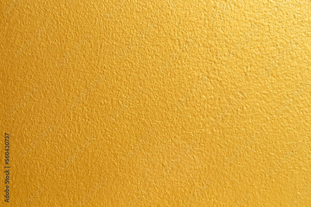 Naklejka premium Golden color with an old grunge wall concrete texture as a background.