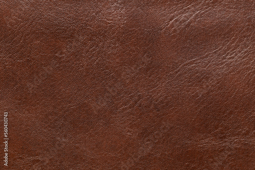 Brown leather and a textured background.