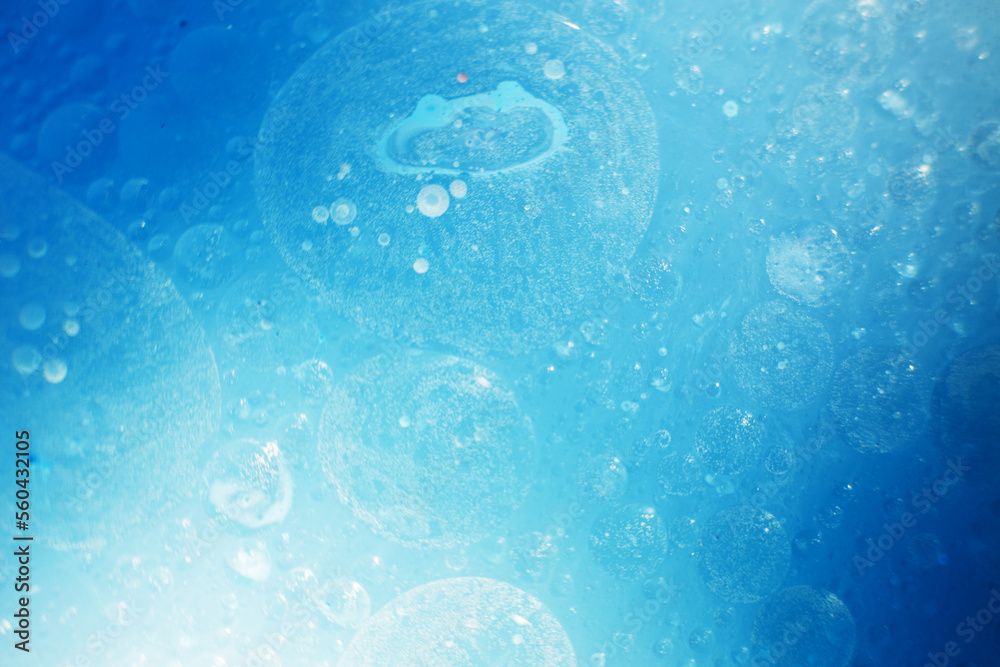 Oil bubbles close up. circles of water macro. abstract light blue background Oil bubbles close up. circles of water macro. abstract light blue background