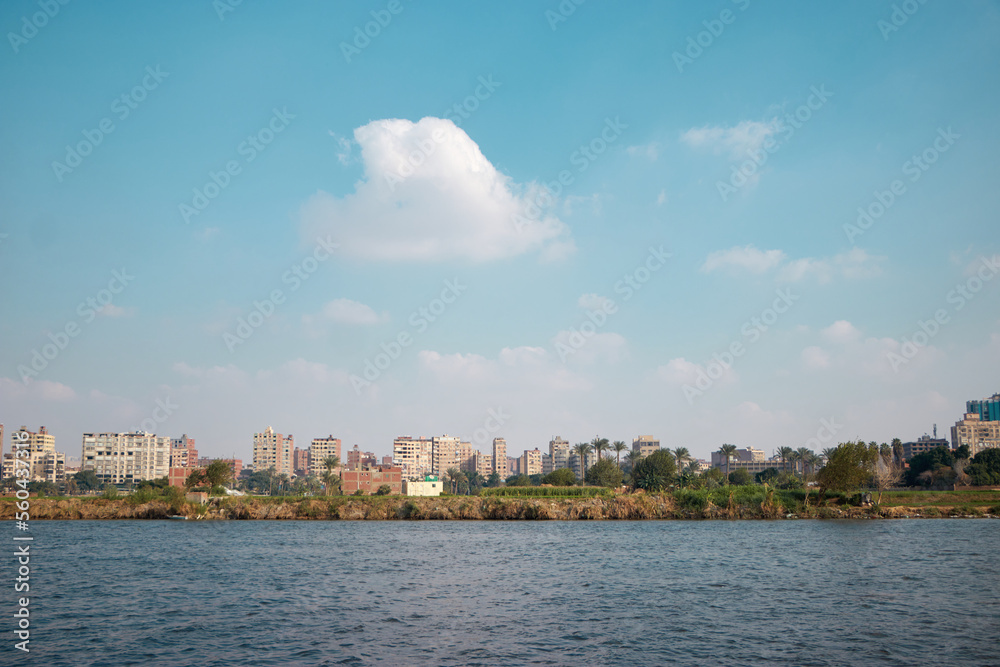 the Nile river bank in Cairo, Egypt with blue cloudy sky