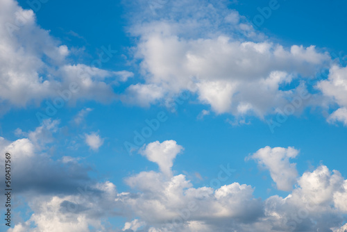 cloud scape with fluffy cumulus clouds, one in a heart shape