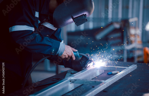 Canvas Print welder worker in his small workshop small industry skillful work Consistency of