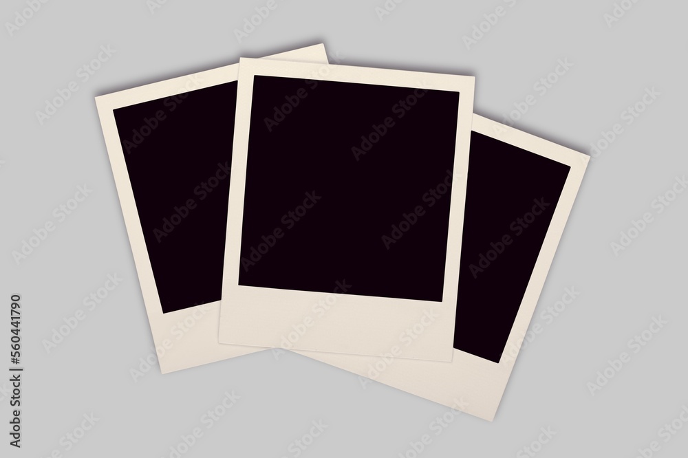 Blank retro photo frames on desk background. Blank retro photo frames on desk background.