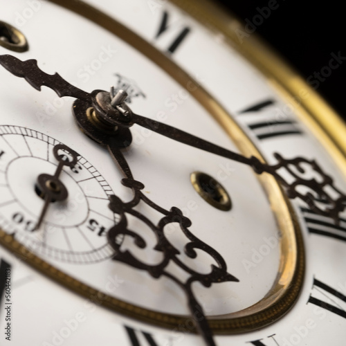 Vintage Clock with Hands. Close up view on clock face of a historical watches with golden frame