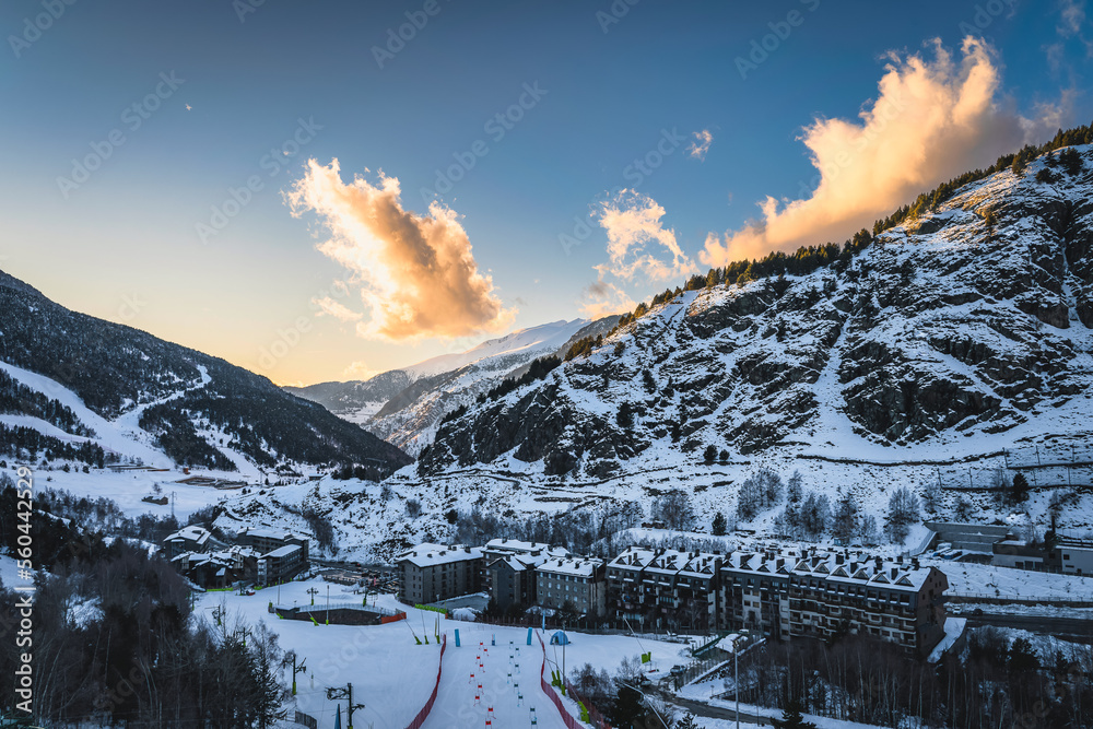 Bars, restaurants, hotels and residential building of El Tarter and Soldeu town at sunset. Ski winter holidays in Andorra, Pyrenees Mountains