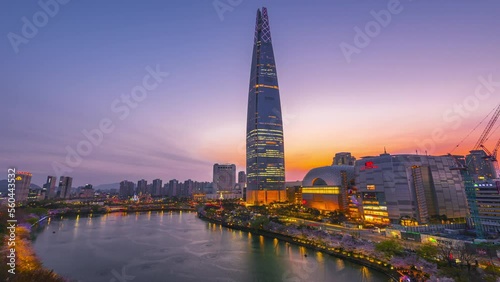 Time lapse 4K, Aerial View of Seokchon lake park and Lotte World Tower at Seoul,South Korea photo