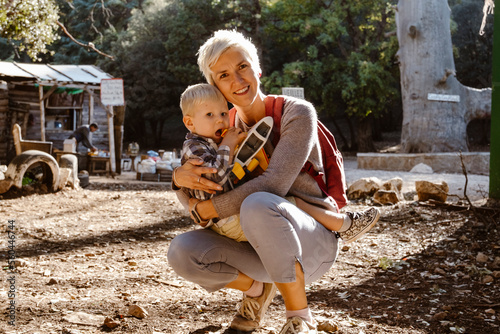 Mother hugging her two years old son wuth an airplane in Cedre Gouraud Forest in Azrou, Morocco,  Africa photo