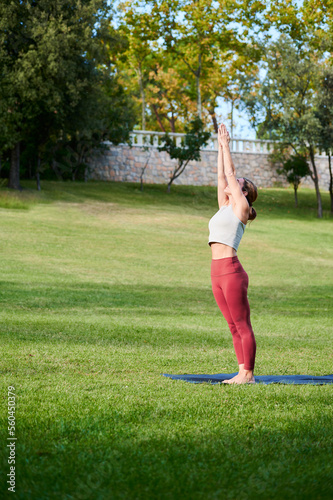 Woman doing Surya Namaskar sequence photo