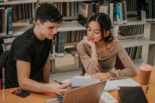 Focused students working on project in library photo