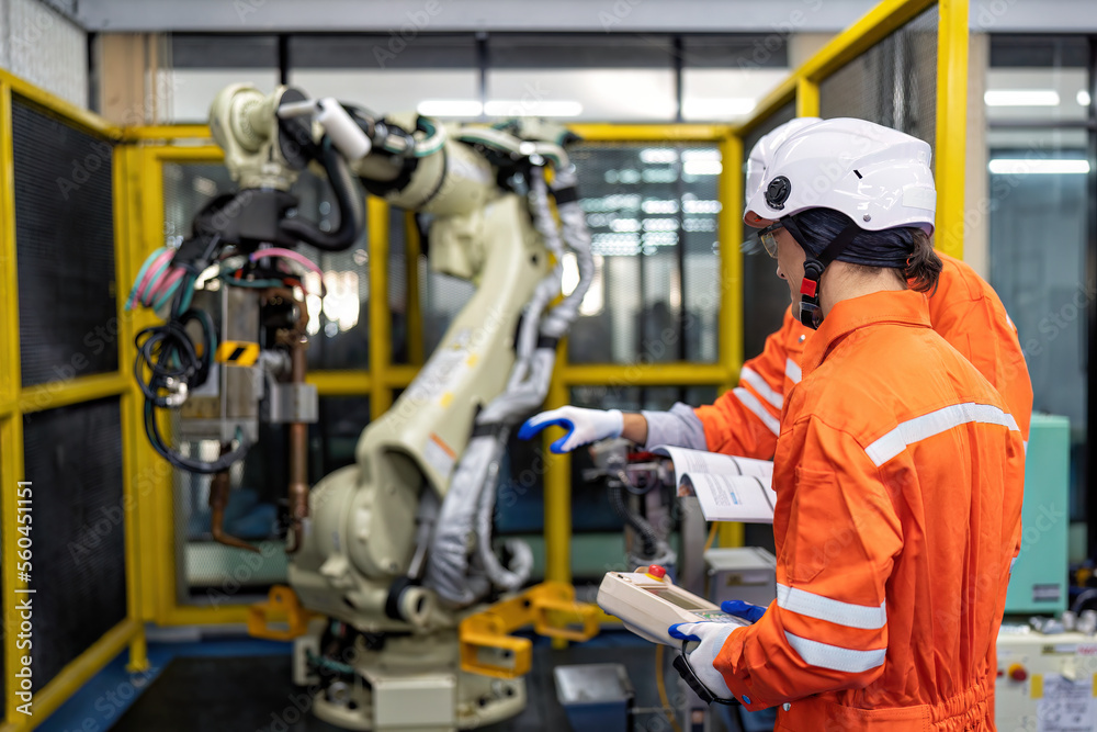 Engineer teach trainee operation maintenance and programing robot arm to work on heavy industry Engineer teach trainee operation maintenance and programing robot arm to work on heavy industry