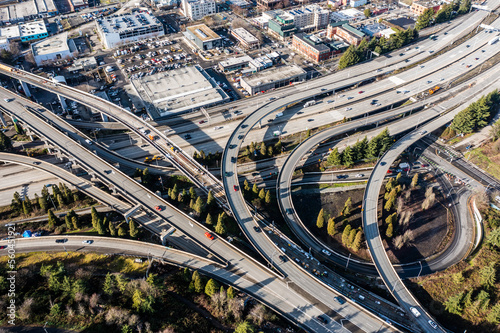 Aerial view of Highway 5 Interchange, located south of Seattle Downtown near the Stadion,  with lots of Car and Truck traffic driving in all directions  