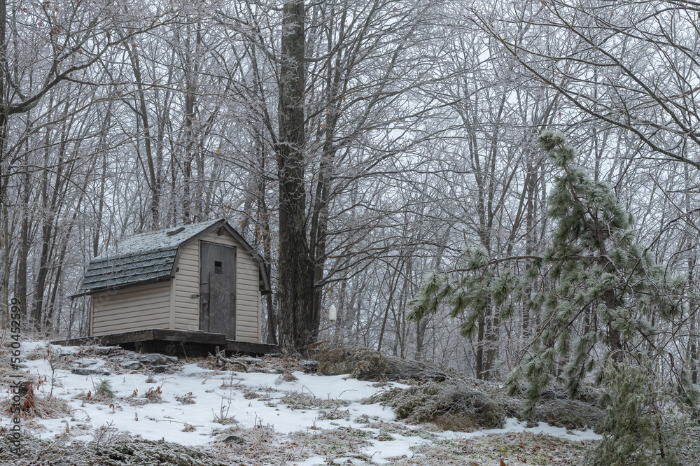 Winter Scene of a Playhouse on a Hill with light Snow