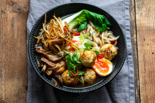Ramen soup with meatballs and udon noodles