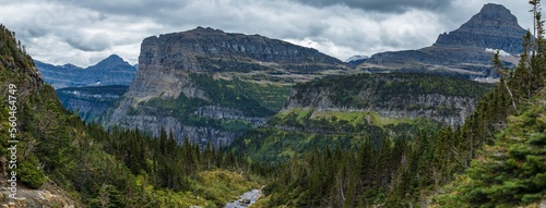 Tall cliff mountains panorama with overcast skies